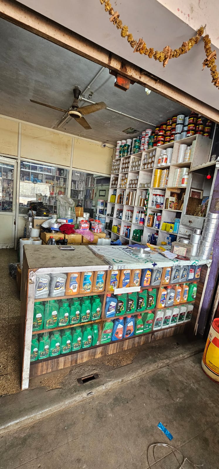 Shop counter stocked with oils, greases and workshop supplies