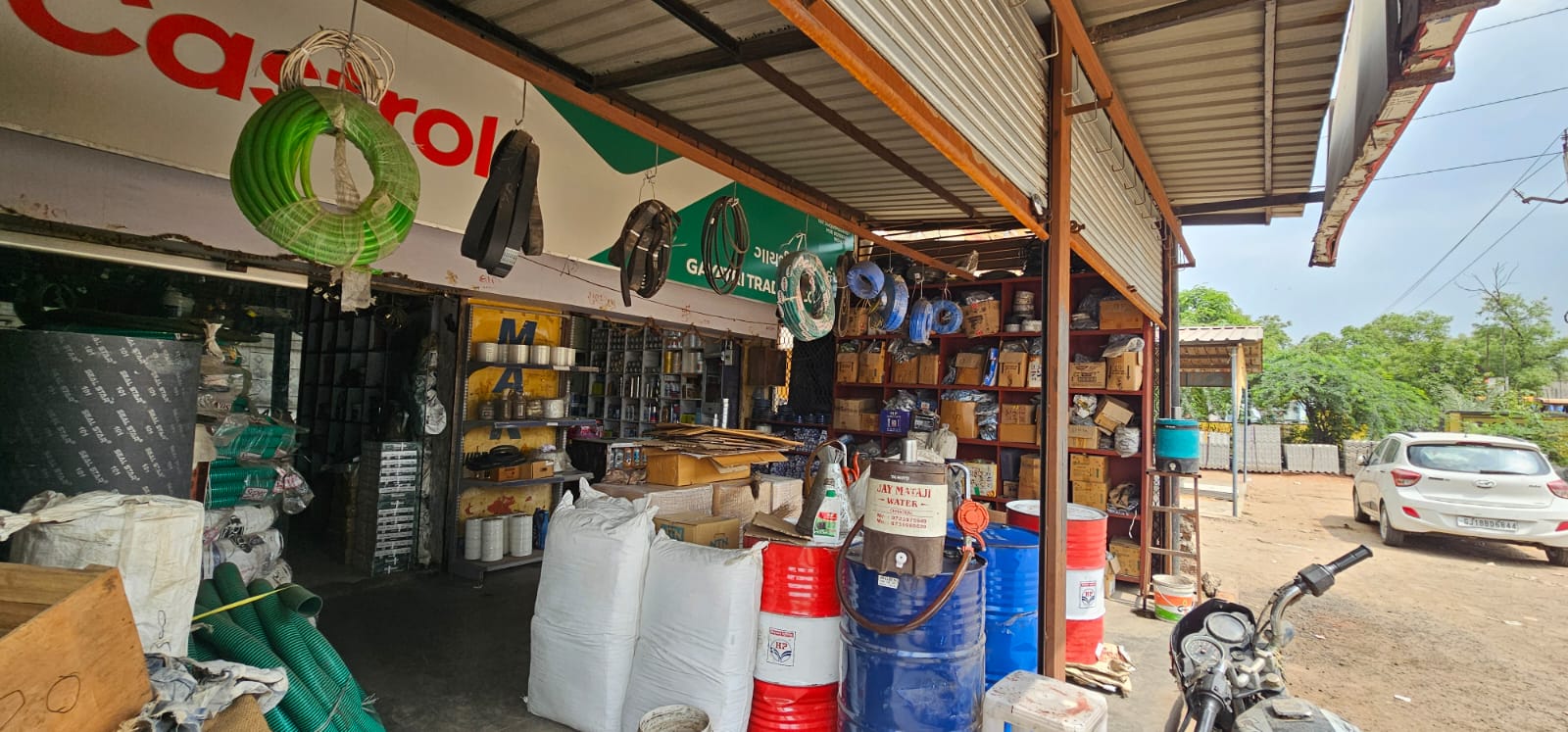 Shop shelves stocked with belts, oils and industrial products